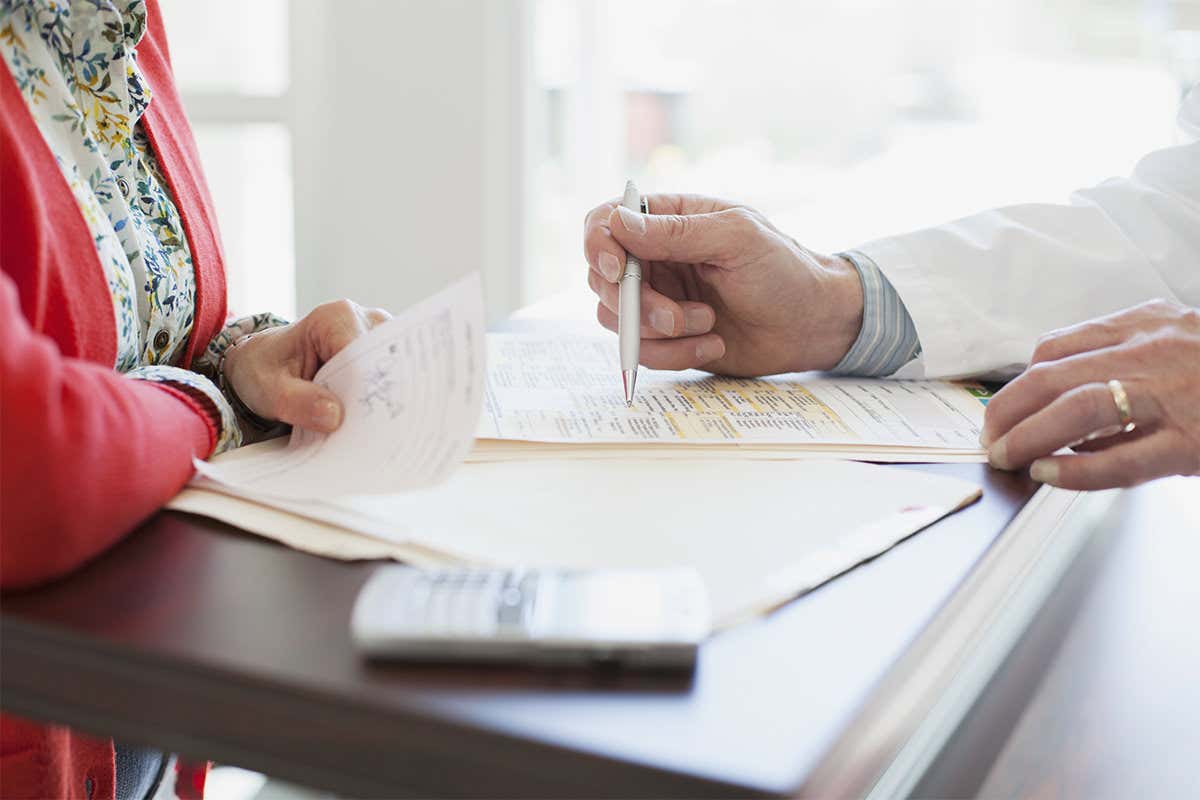 Doctor consulting written notes