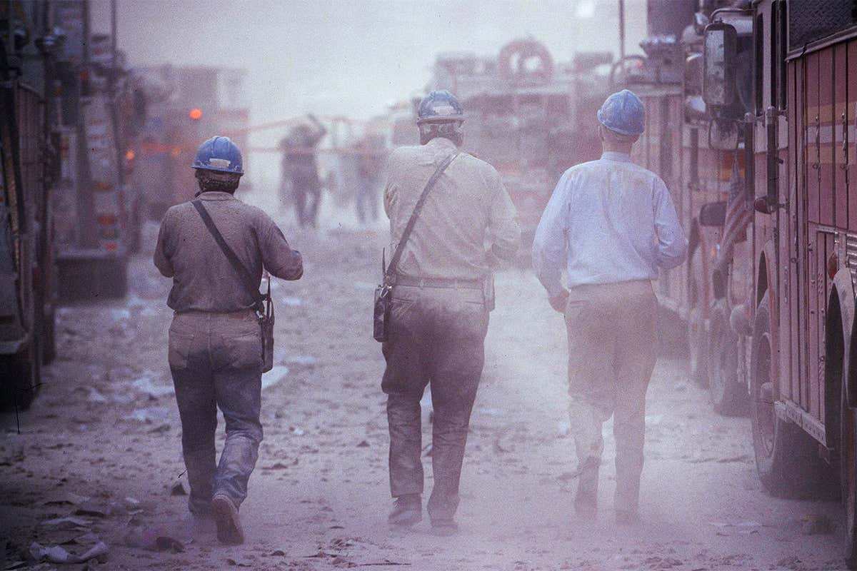 People searching through the dust