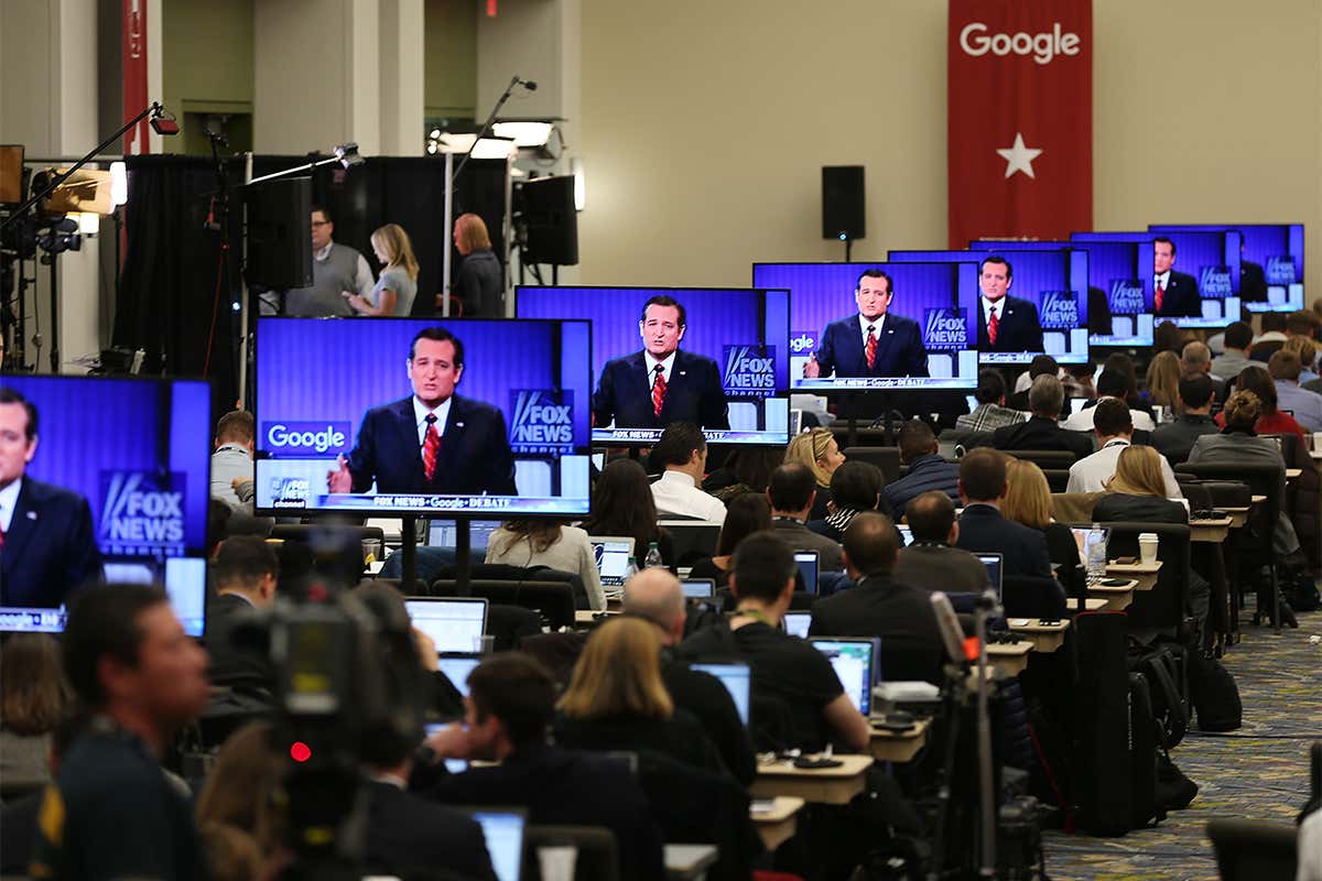 Ted Cruz appears on multiple TV screens with Google banner in background