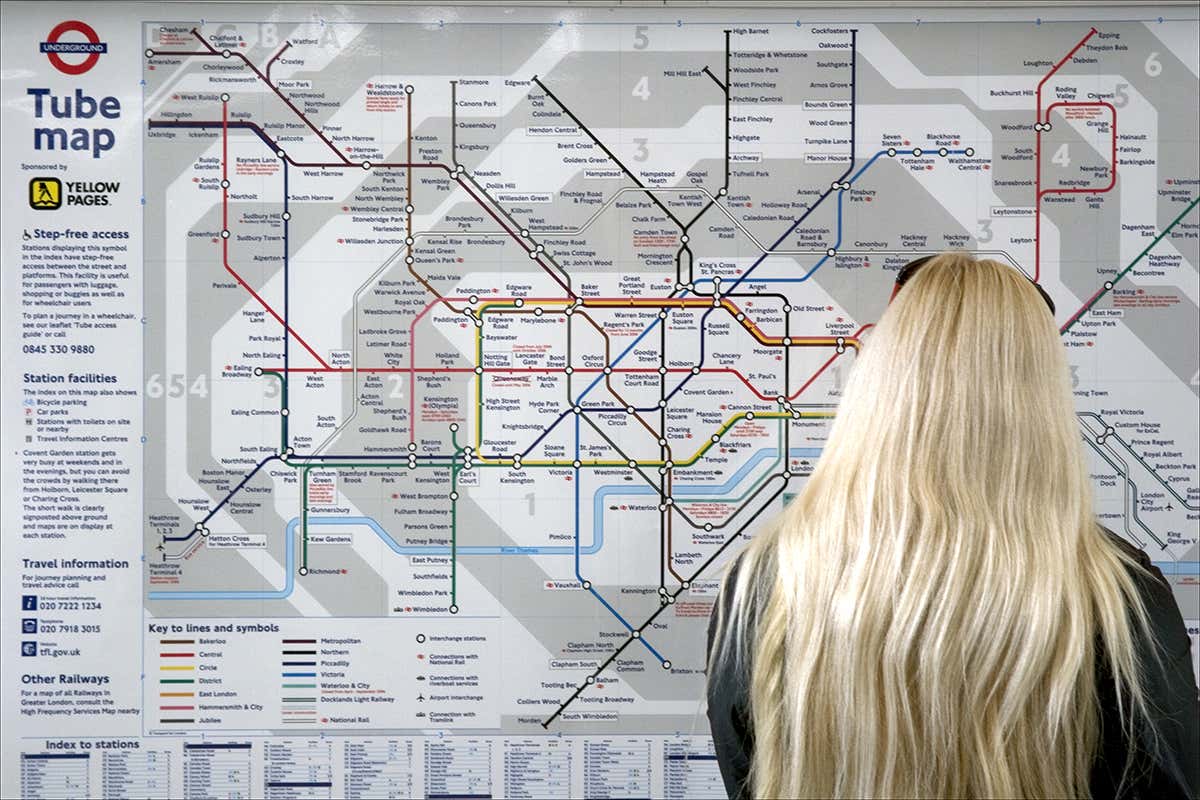 Woman looking at a tube map