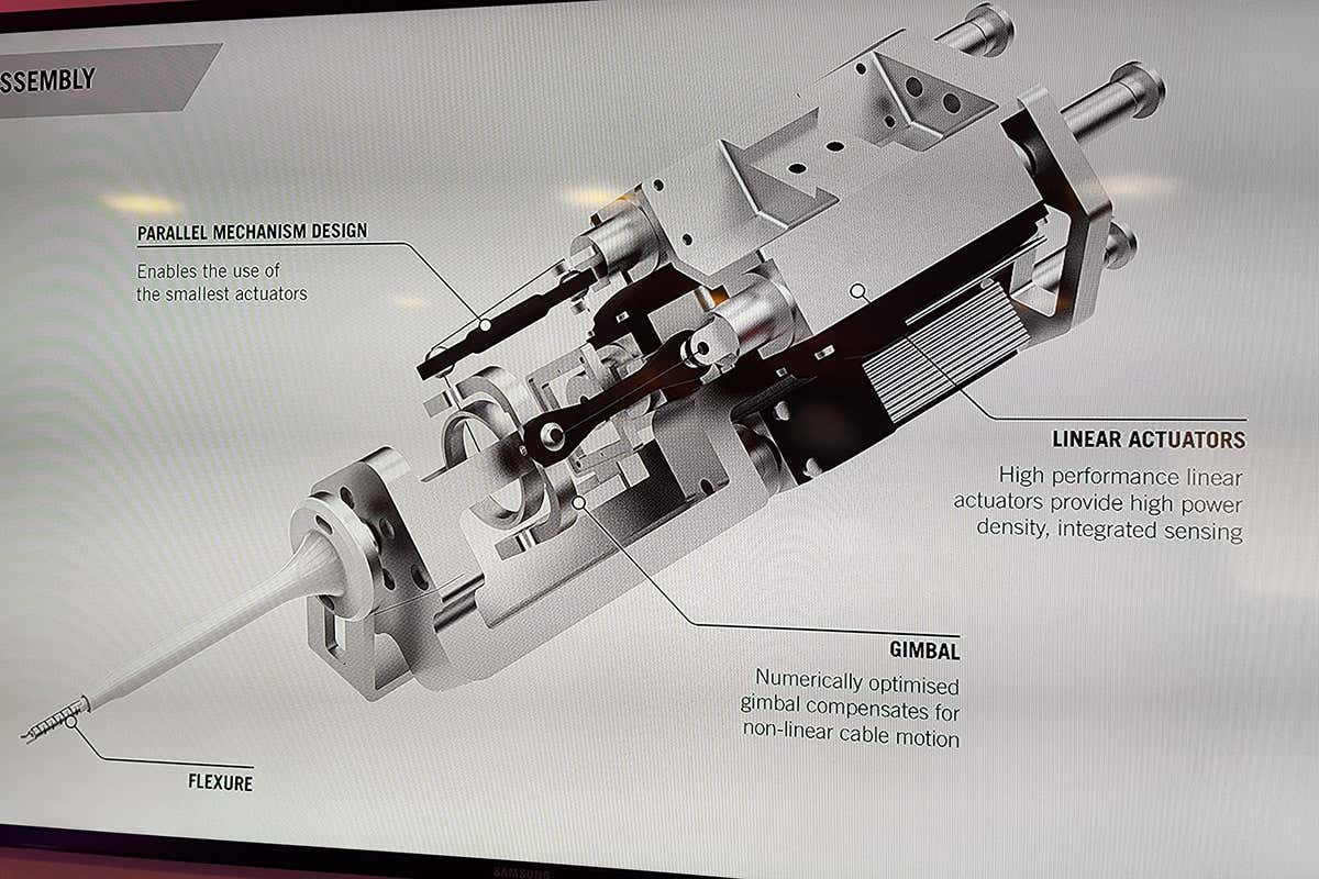 A close-up view of one of the robot arms and its pincer attachment