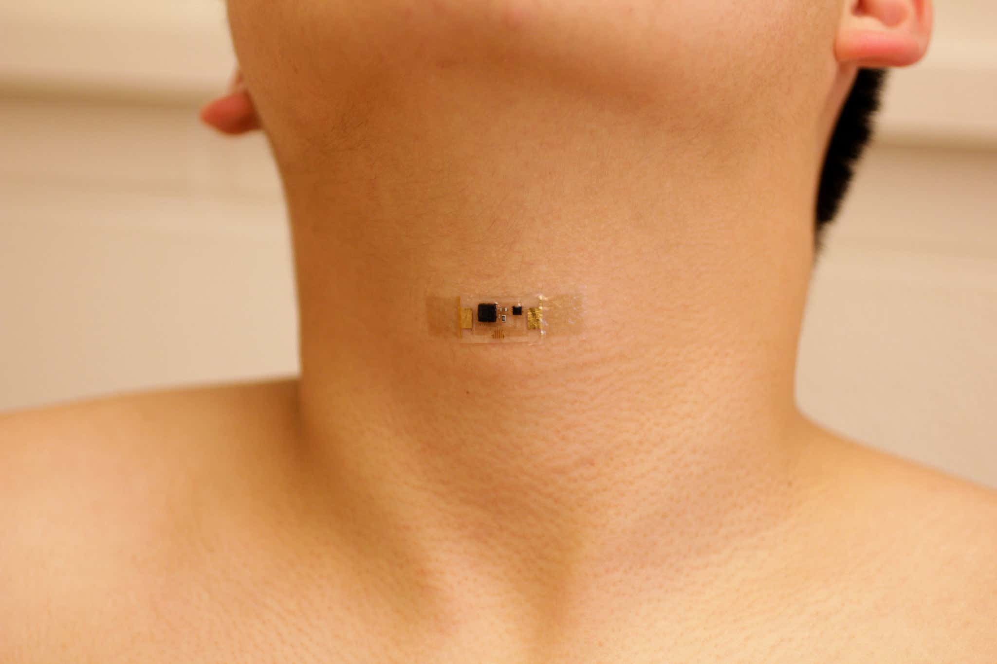 Skin patch stuck to a person's throat