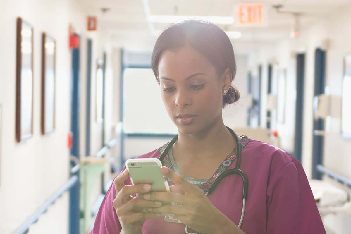 Doctor checks her phone