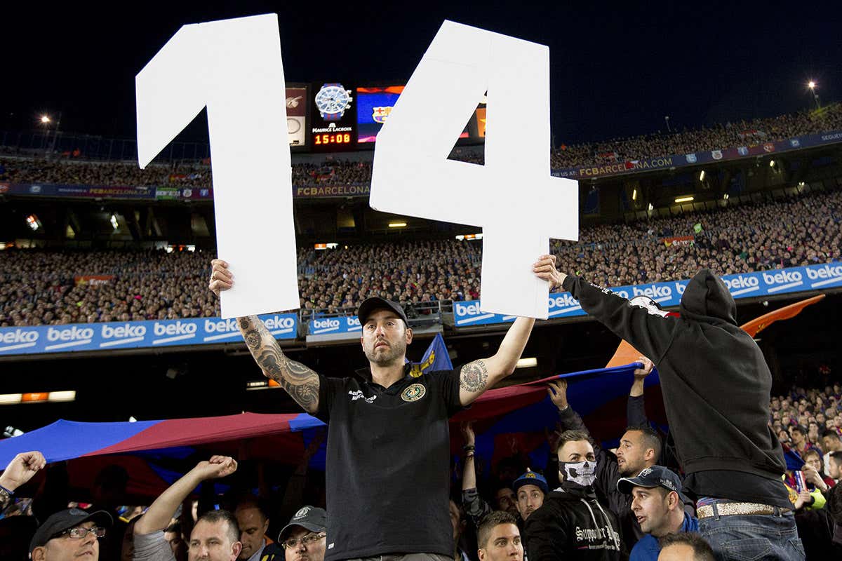 Man in crowd holding figure 14