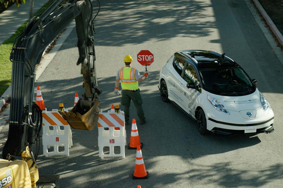 A Nissan car stopped by an unusual roadblock