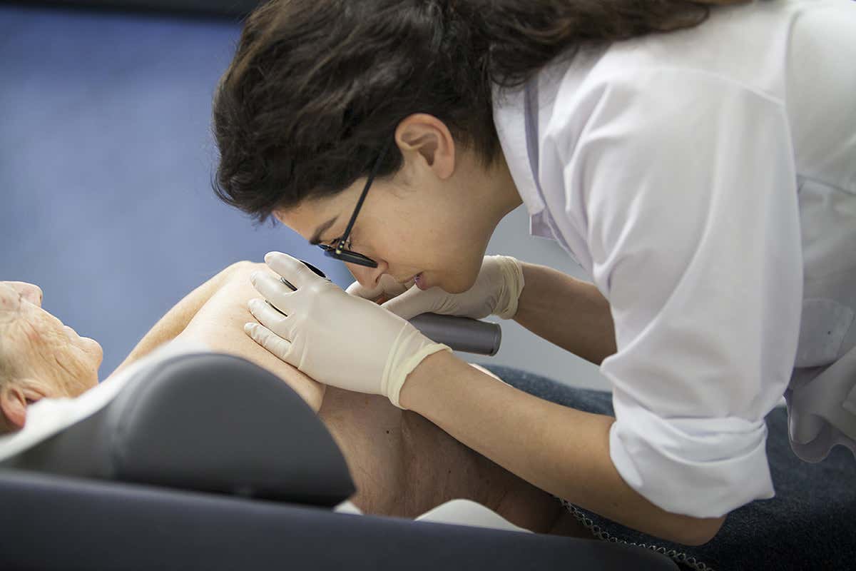 dermatologist examining skin