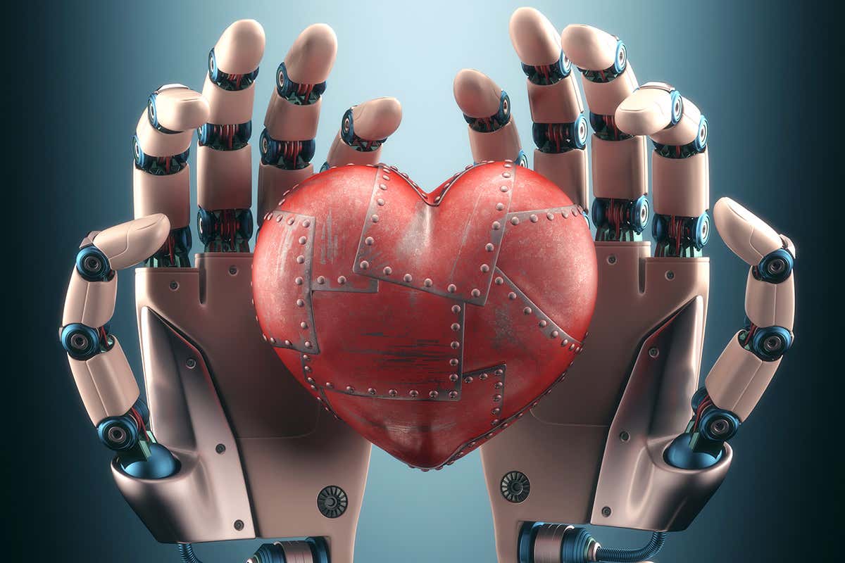 A metalic heart resting in robotic hands