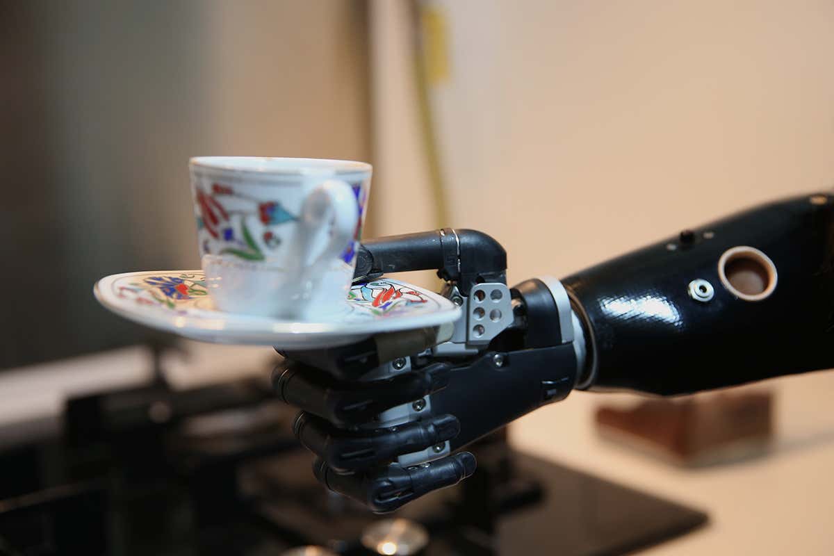 Prosthetic arm holding teacup
