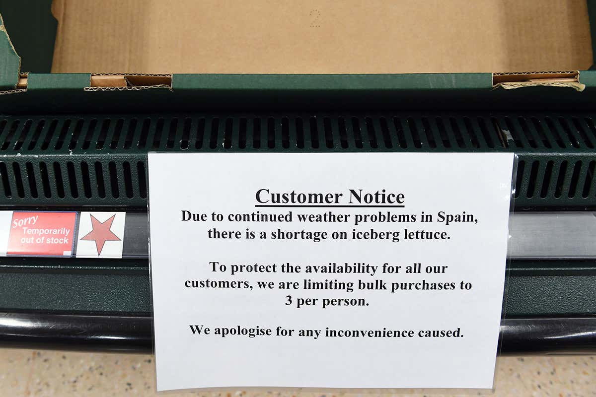 Notice warning of limits on lettuce buying, stuck on an empty box