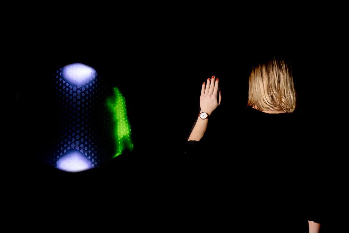 A green man displays when the pedestrian raises a hand