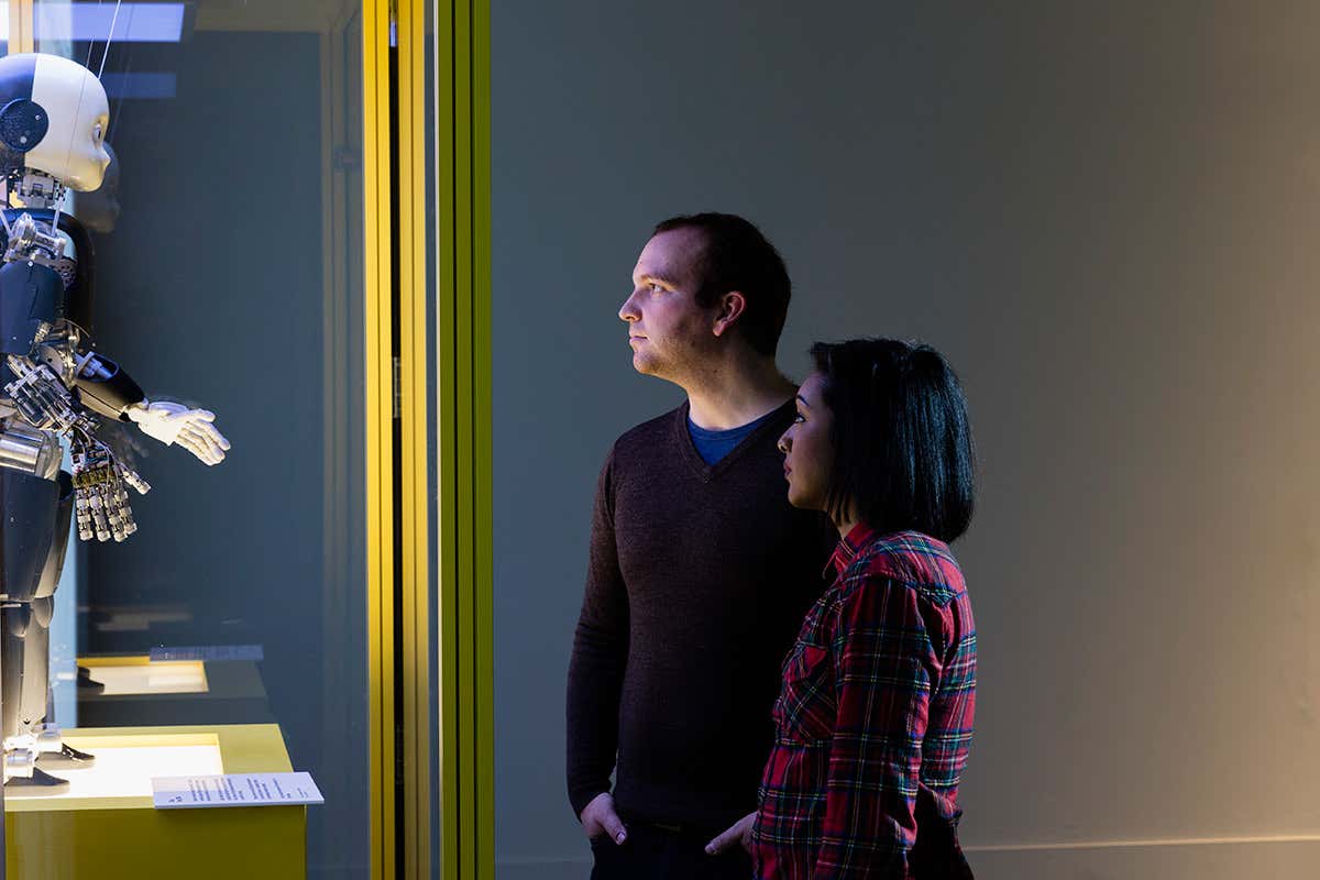 visitors looking at iCub