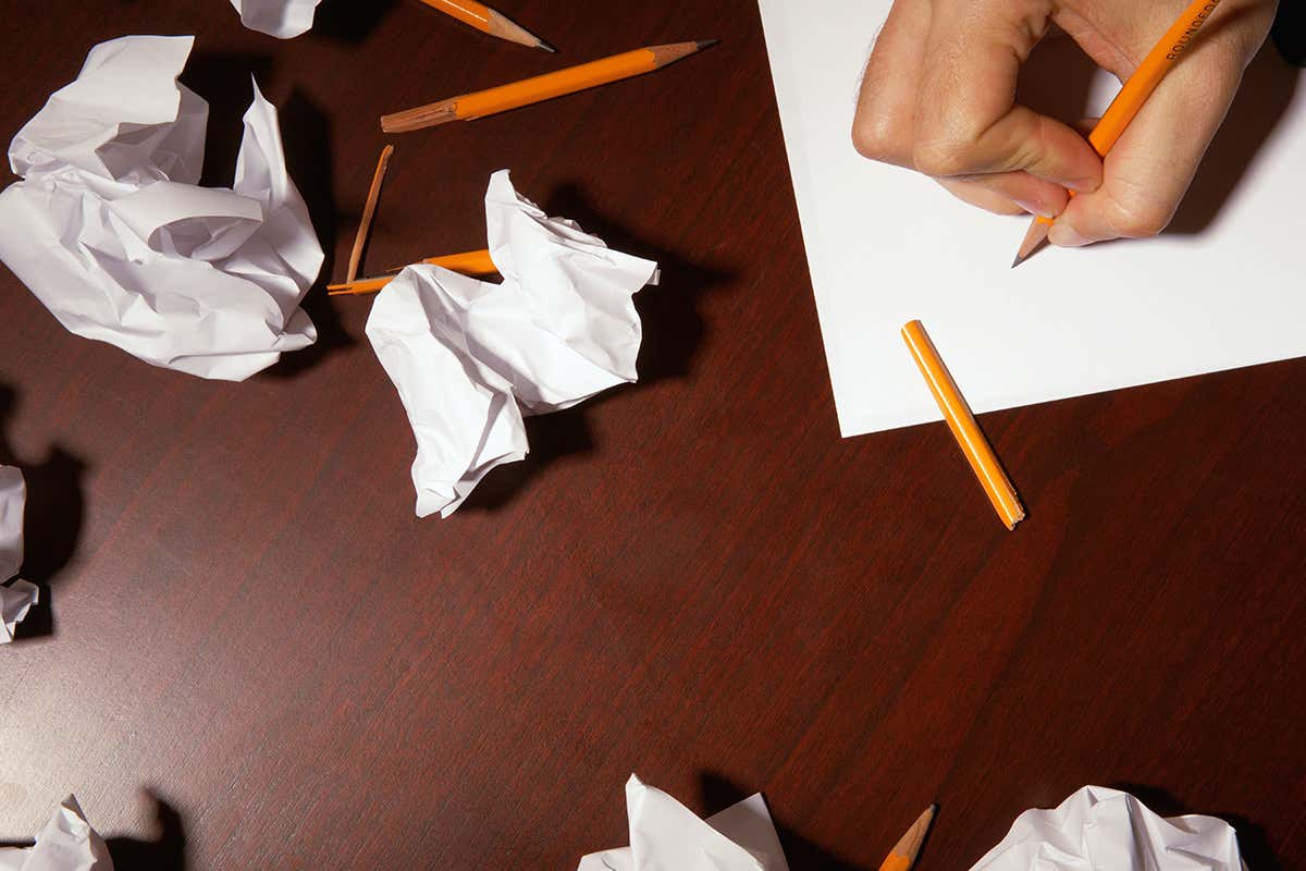 Crumpled paper and broken pencils on a table