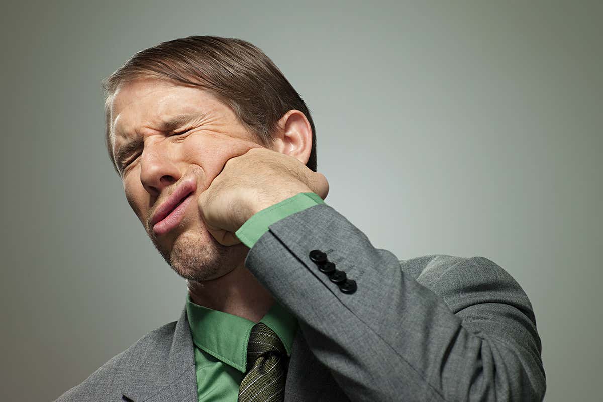 Man punching himself in the face