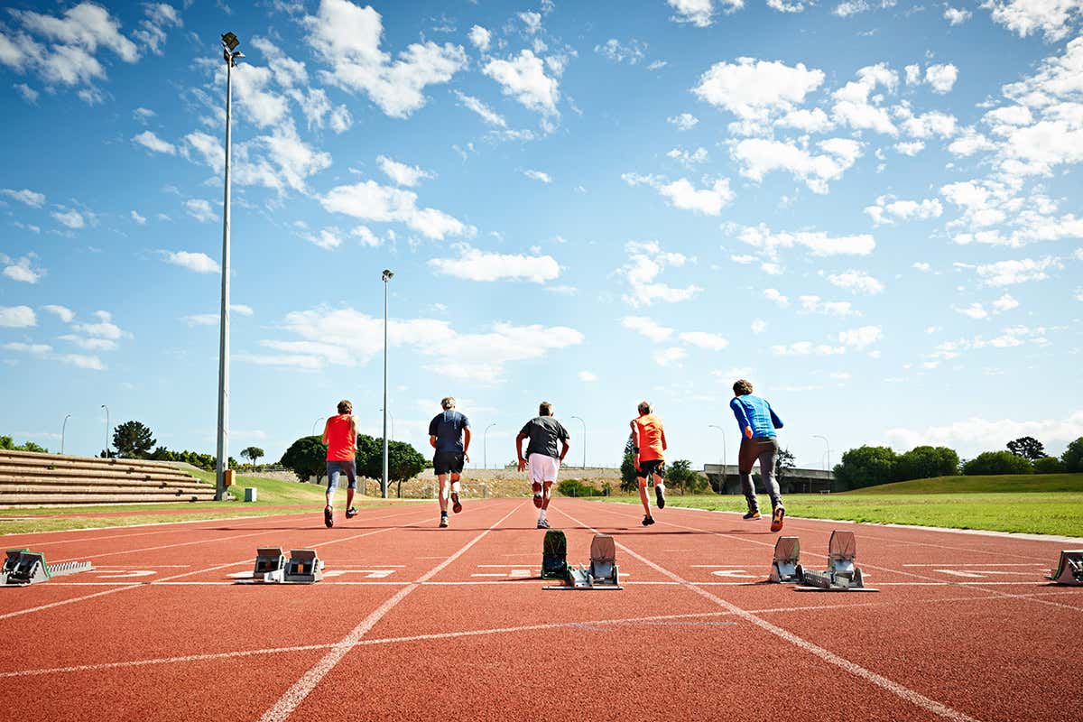 Five sprinters who have just left the starting blocks