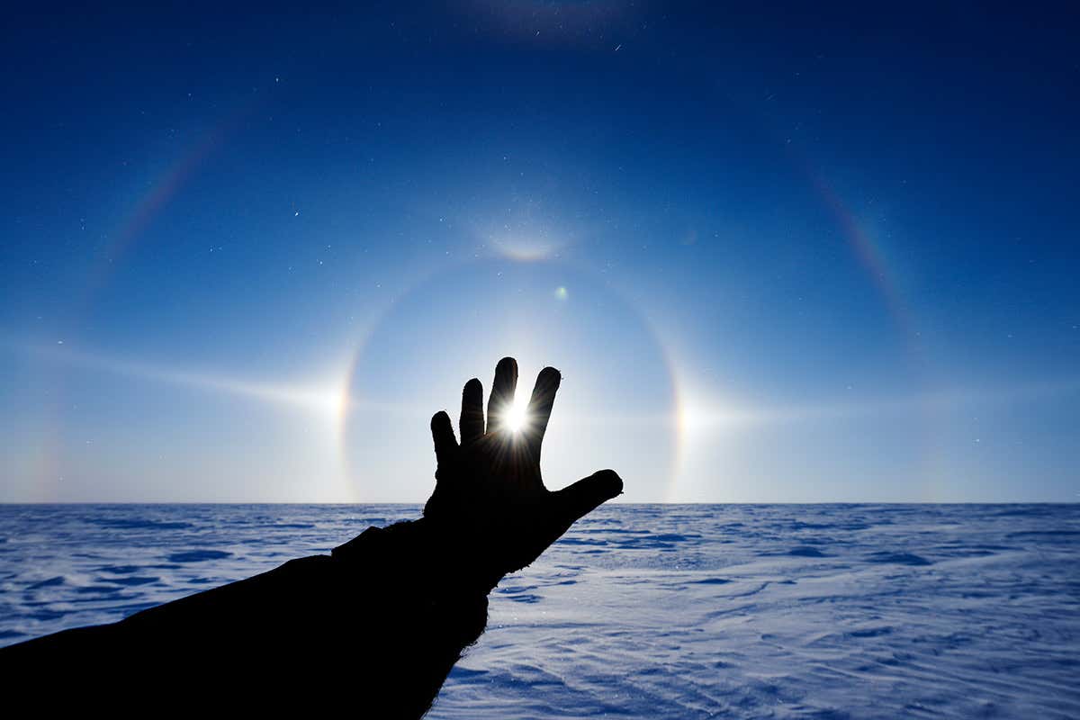 A hand held up in an icy land