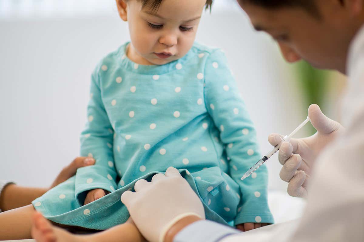 A young child getting an injection