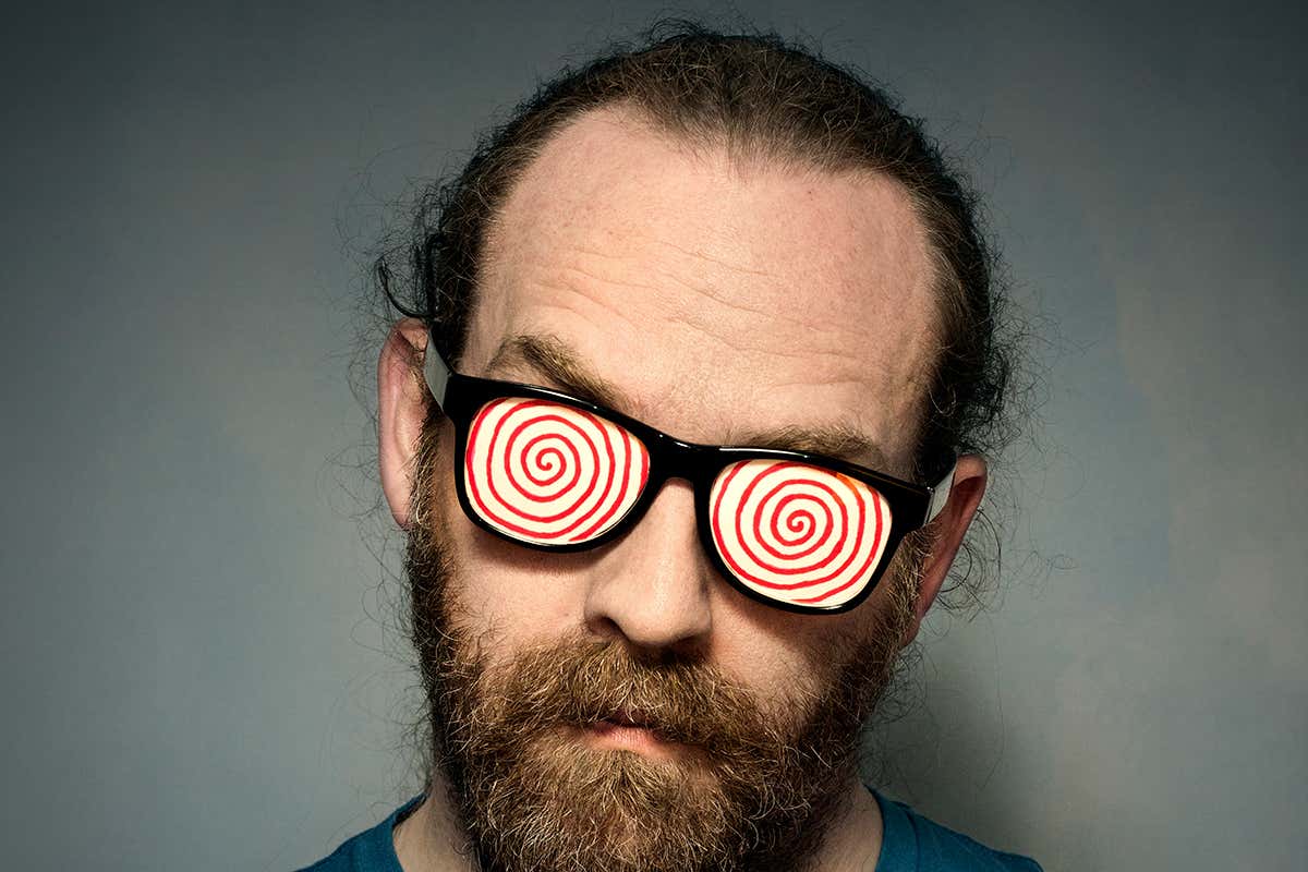 A man wearing hypnotic glasses
