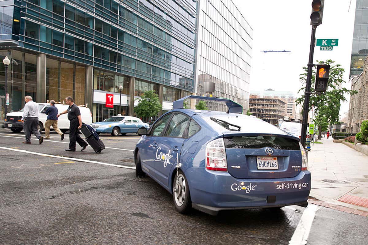Google self-driving car pauses as people cross road in front of it