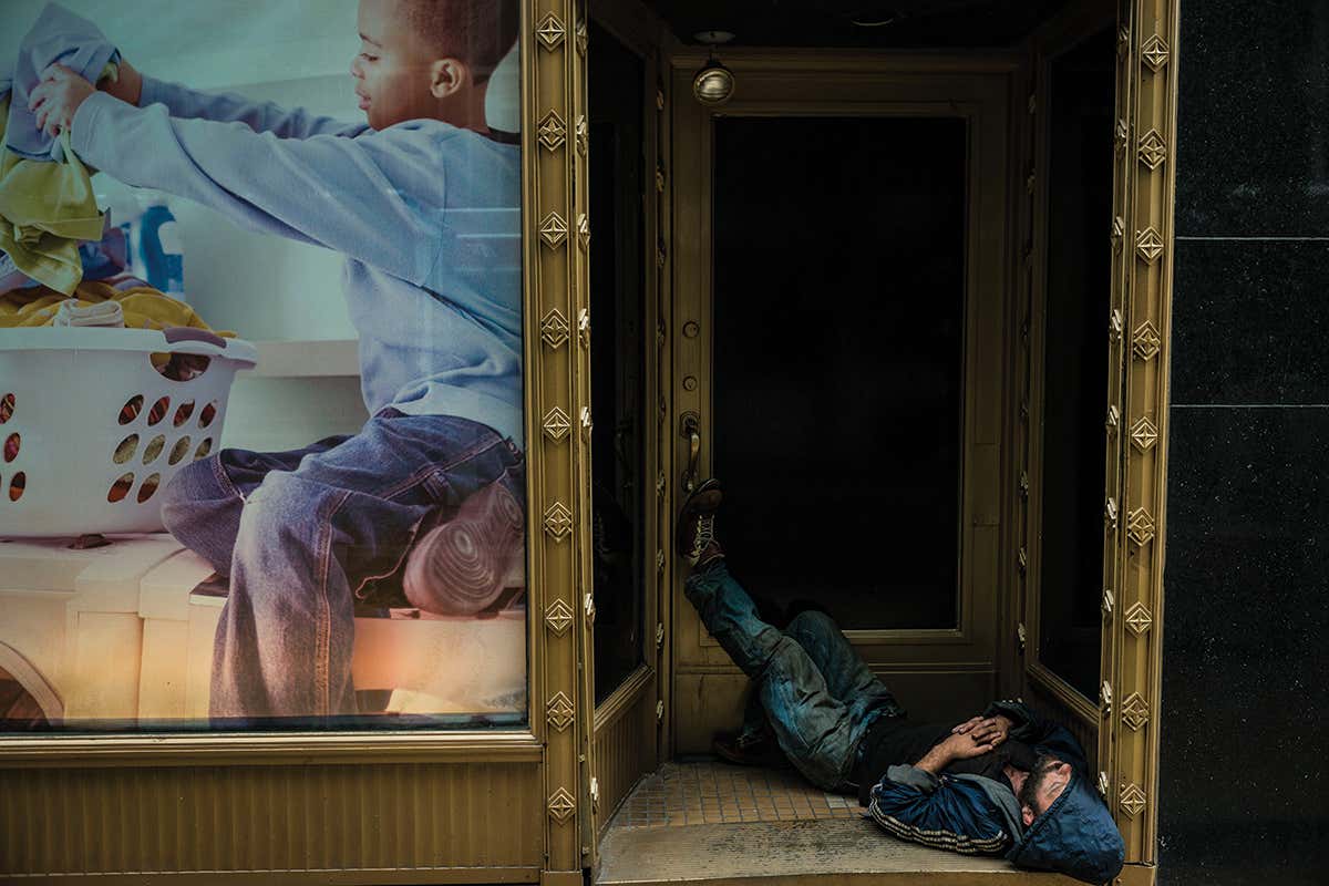 person sleeping in a doorway