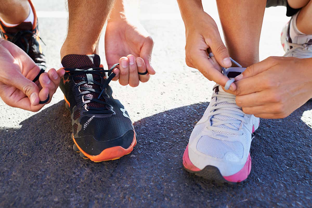 Runners tying shoelaces