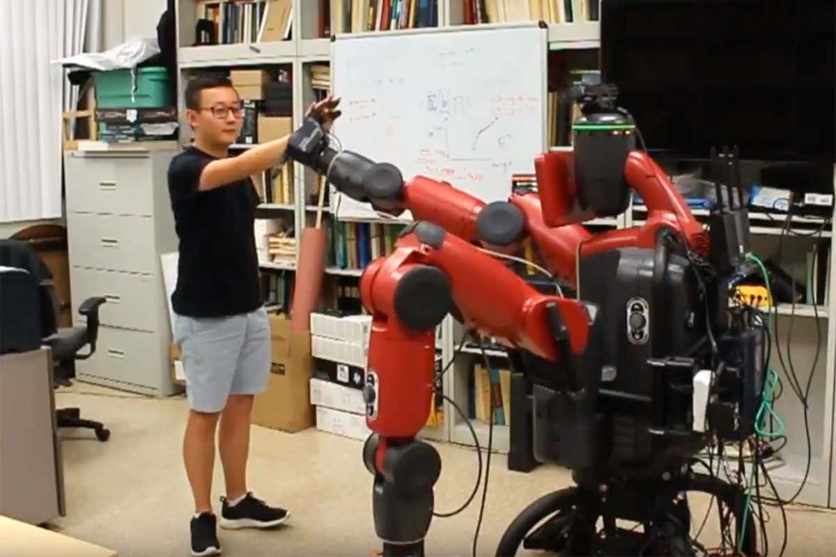 Robot high-fiving man