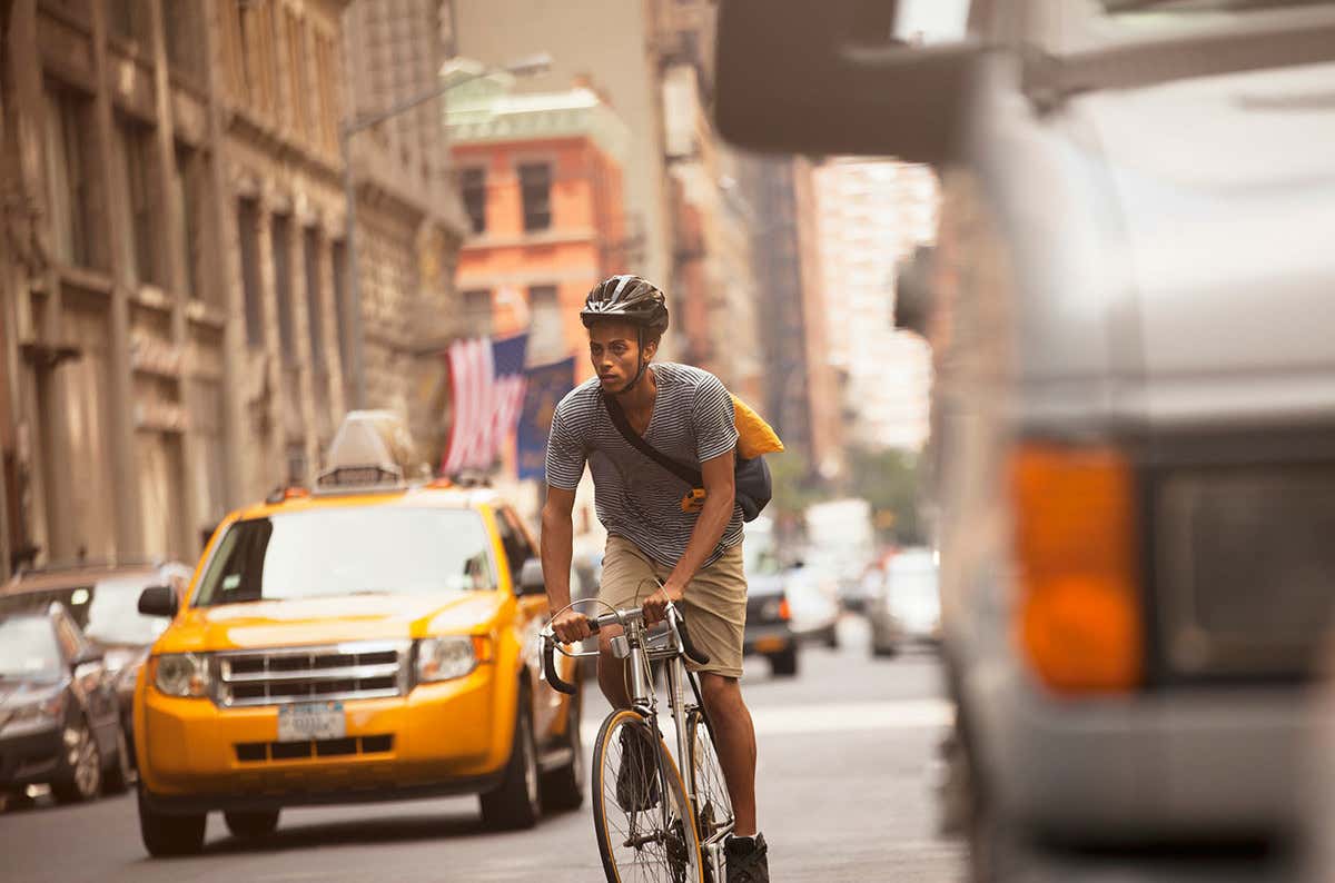 a man on a bike in the city