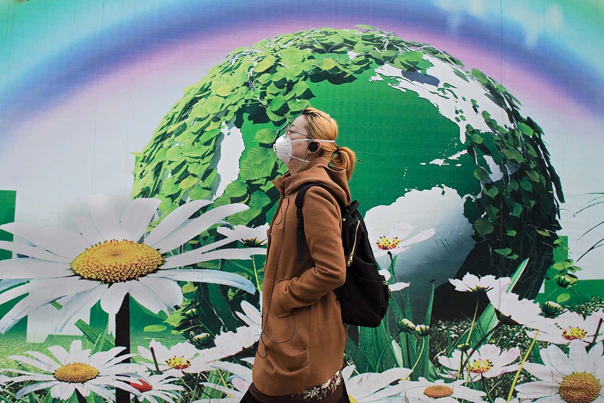 A woman wearing a face mask to filter out polluted air