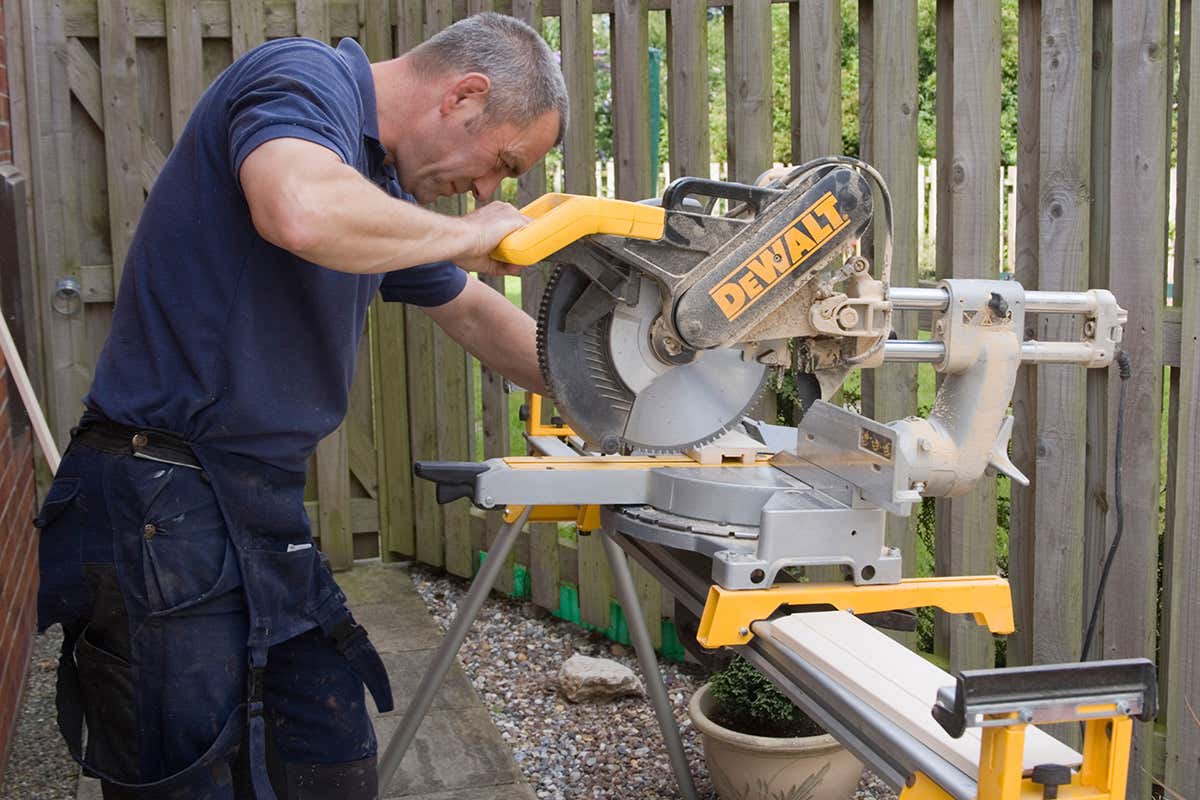 A man operating a circular saw