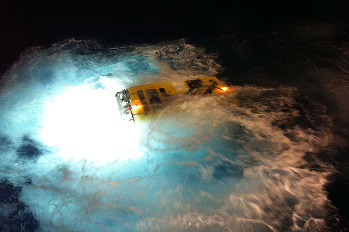 A submarine-like remotely operated vehicle being launched