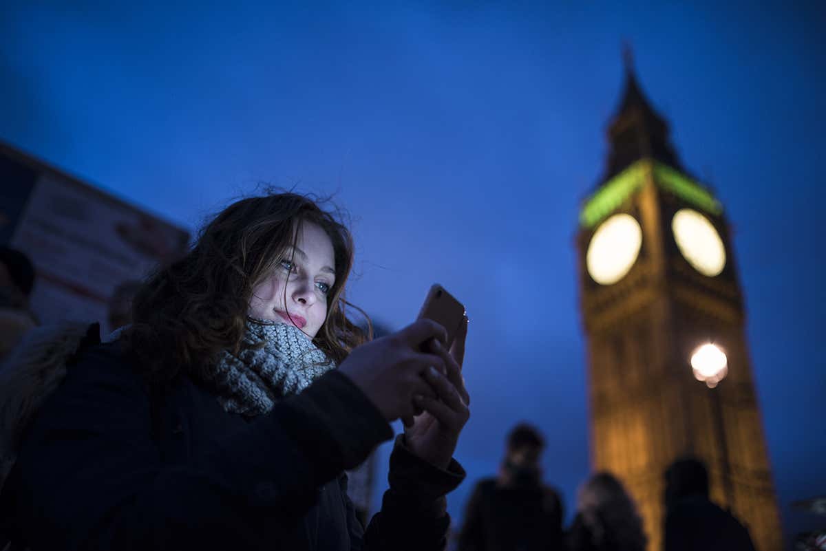 A woman in front of Big Ben
