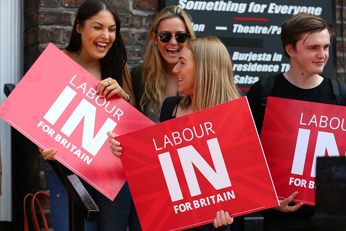 Supporters wait to greet Labour Party leader Jeremy Corbyn as he arrives at a student voter rally at on 13 May 2016 in Liverpool, England