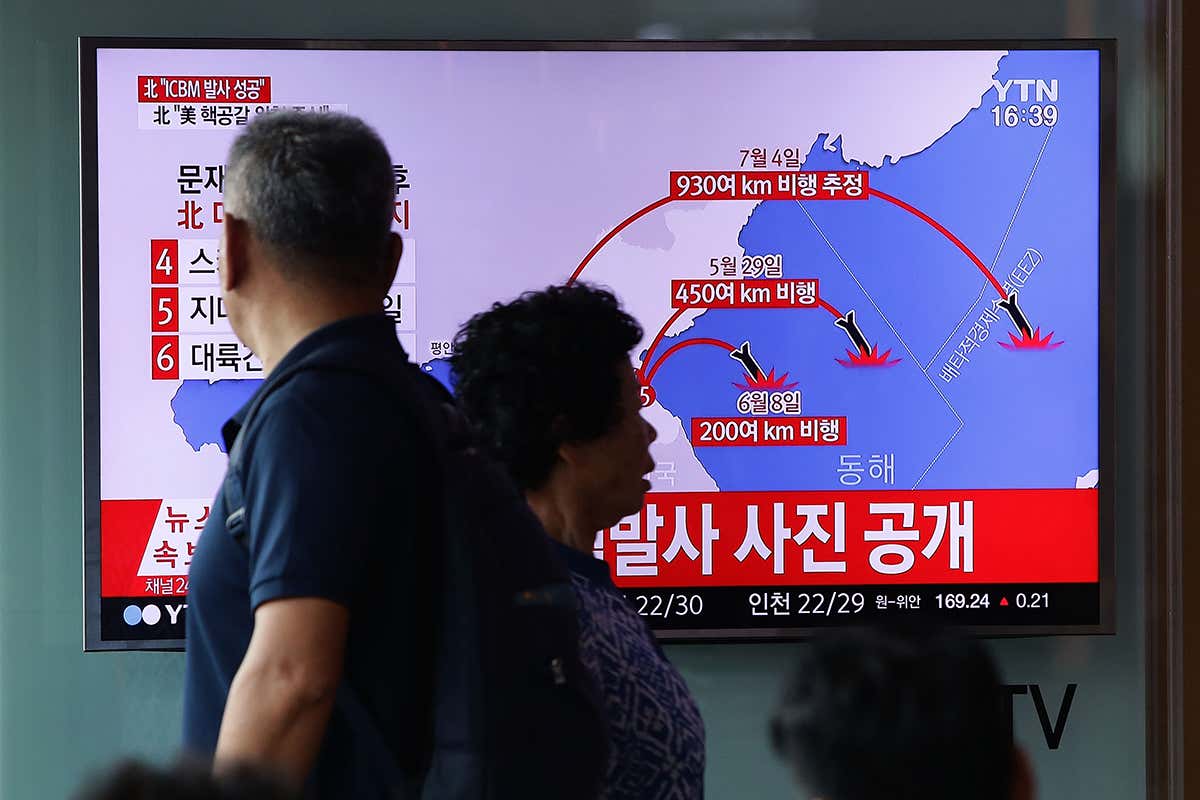 A man watches news of a North Korean rocket launch