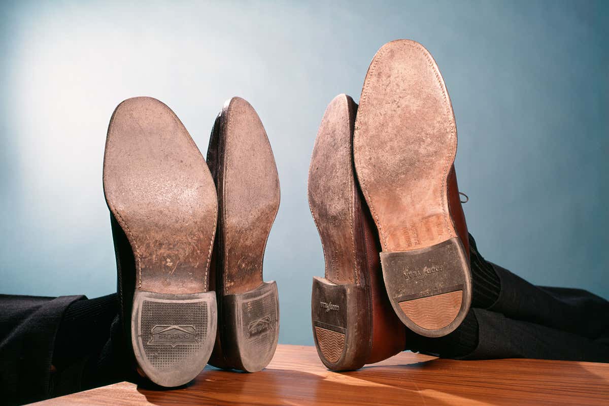 Male executive shoes on desk