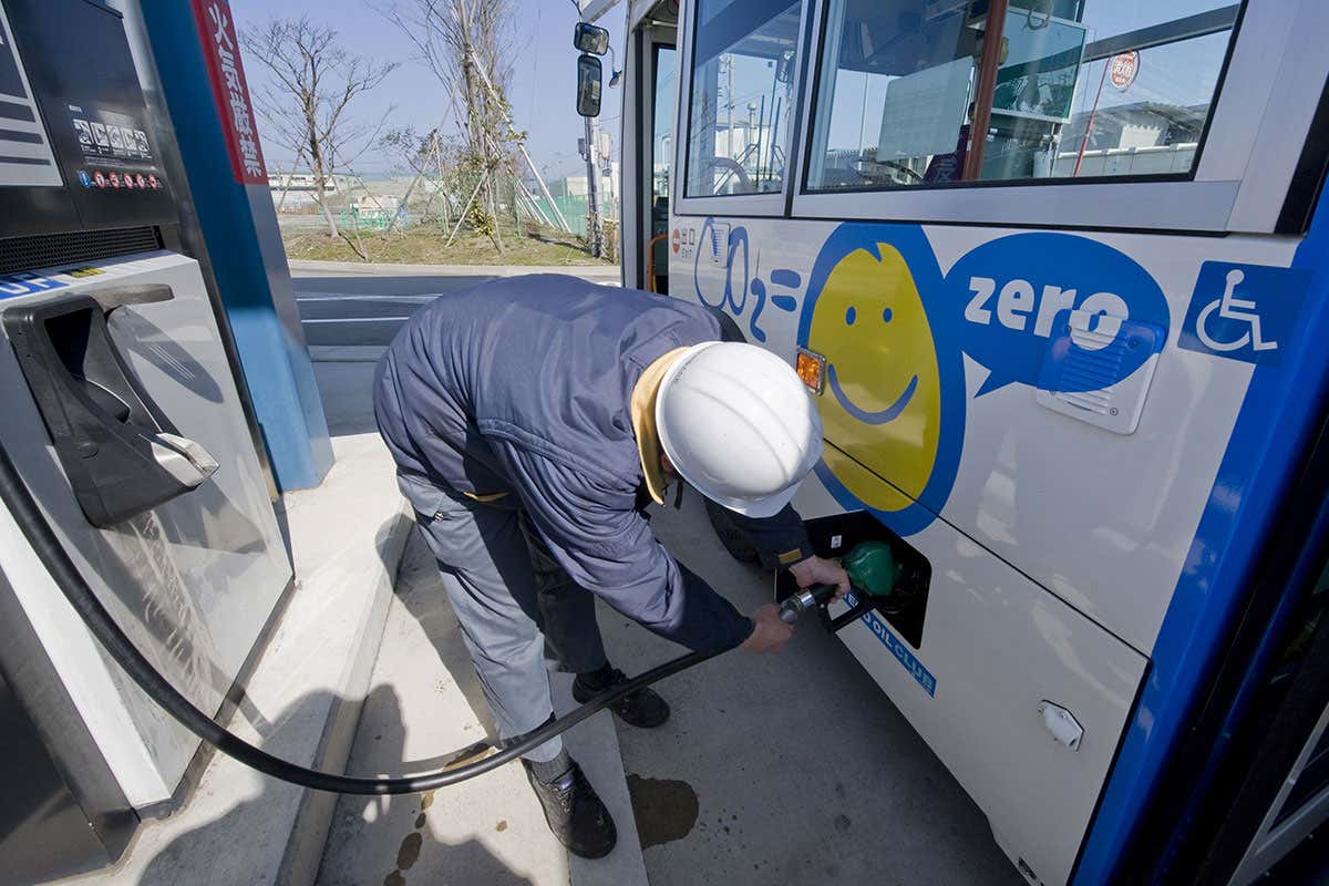 A bus being filled with biofuel