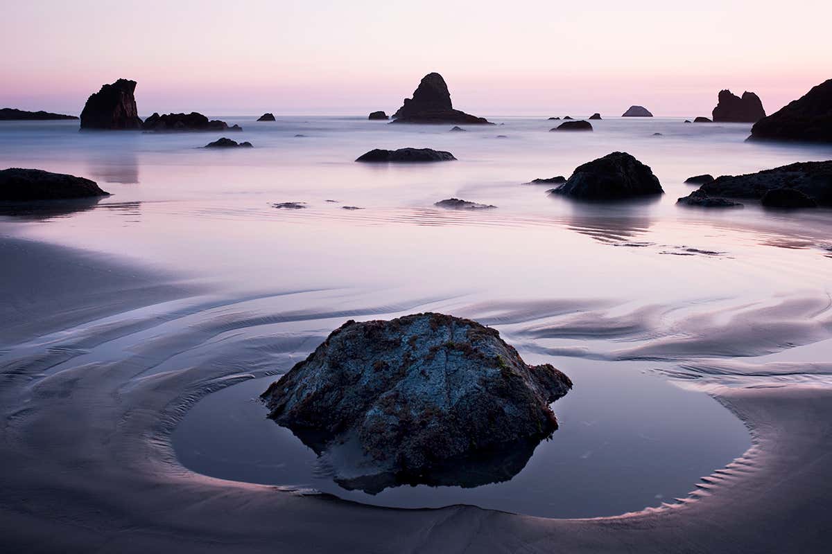 Tidal pool under a lilac sky