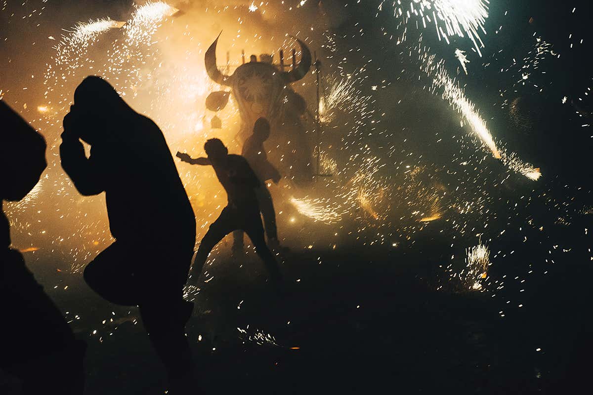 Shadowy figures and fireworks