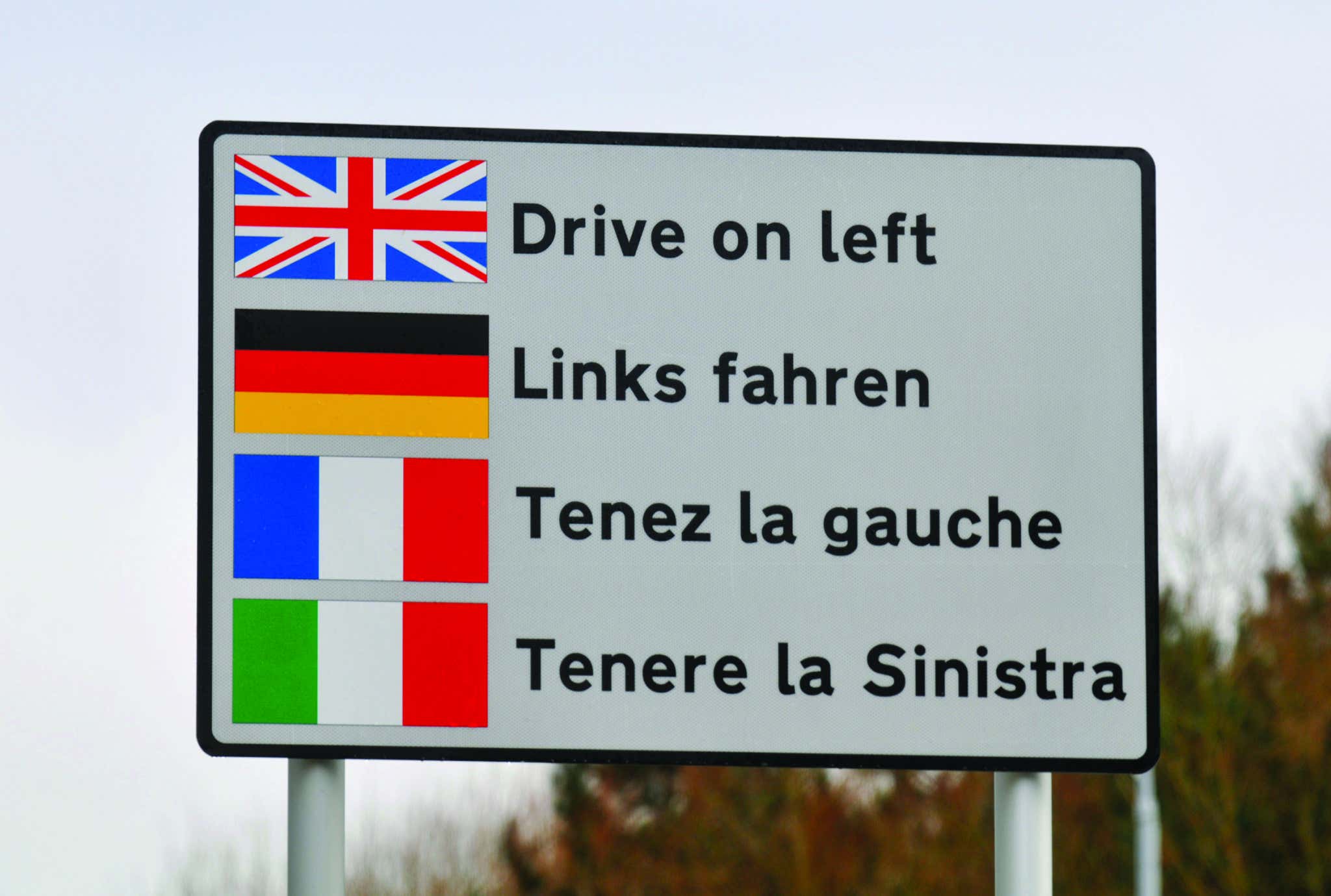 drive on left warning sign