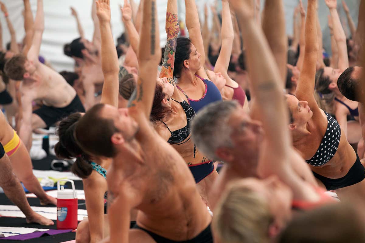 Yoga class doing a side bend