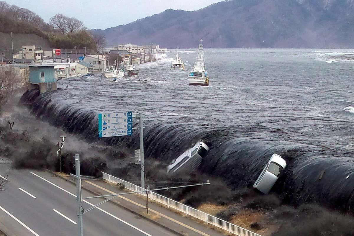 Cars being carried on the back of a tsunami
