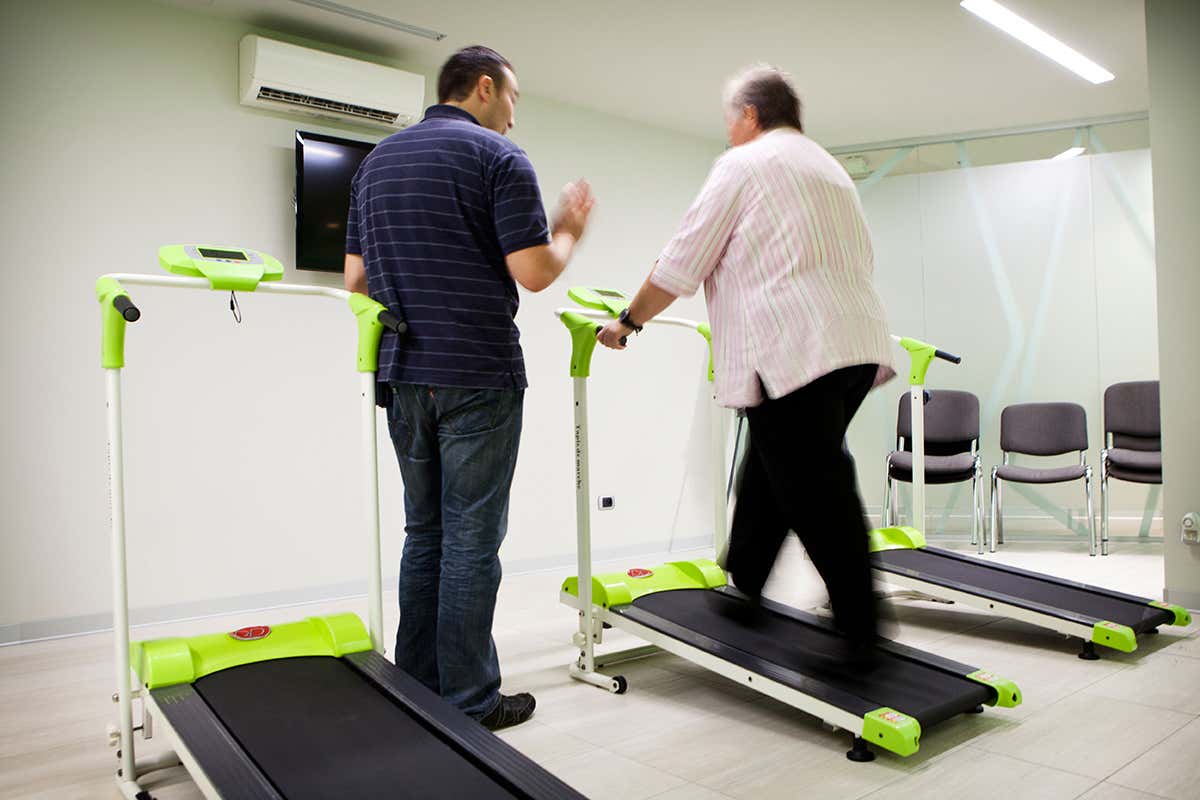 An overweight person on a treadmill