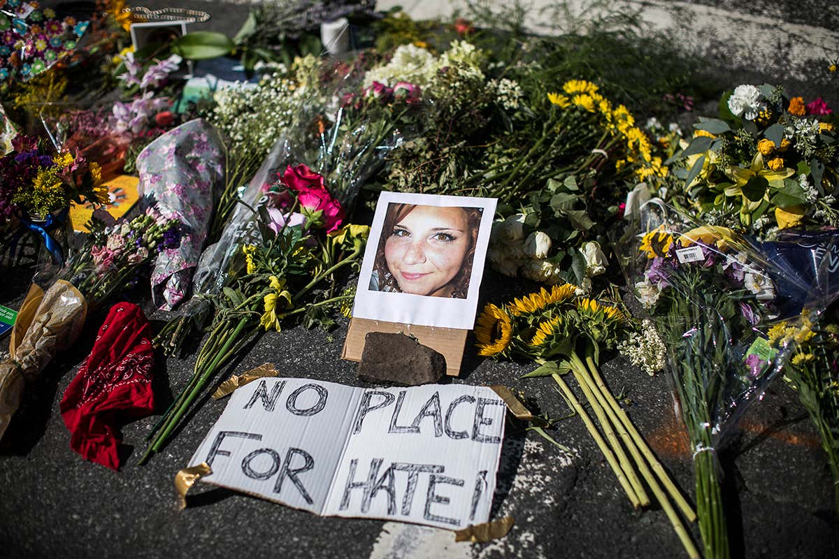 A makeshift memorial that includes a photo of Heather Heyer, who was killed, at the site where on Saturday a car plowed into a group of counter-protesters after a
