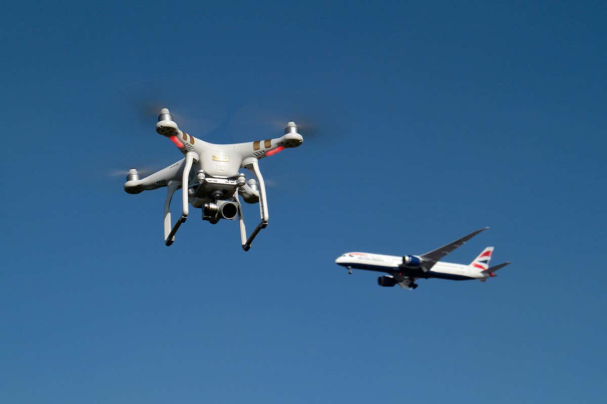 Drone in foreground with jet aircraft in background