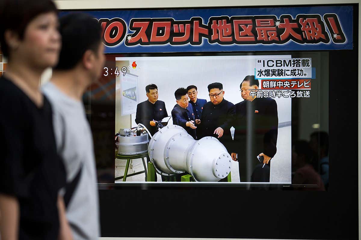 Kim Jong-un pictured with the bomb that may have been behind the blast