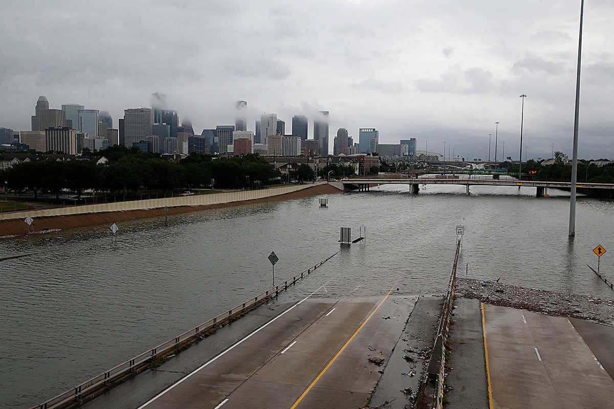 The downtown Houston skyline and flooded highway 288 are seen August 27, 2017 as the city battles with tropical storm Harvey and resulting floods