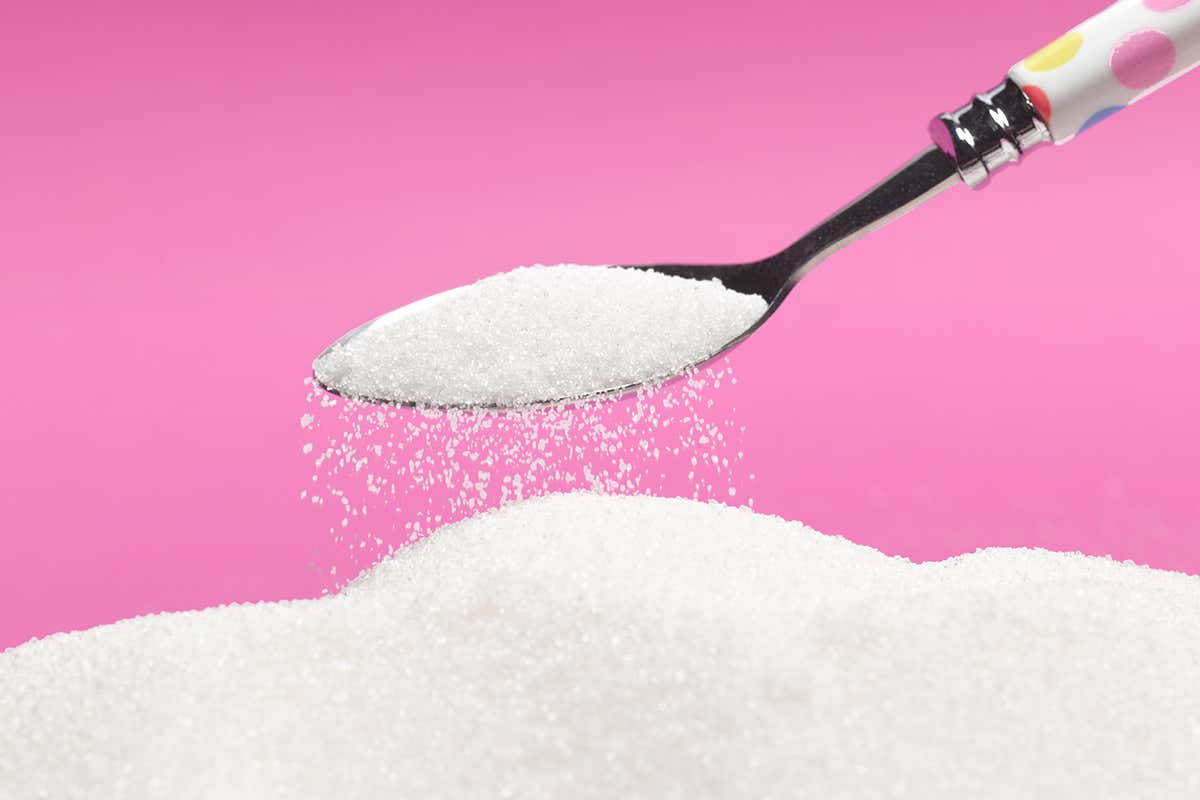 Spoon scooping up sugar