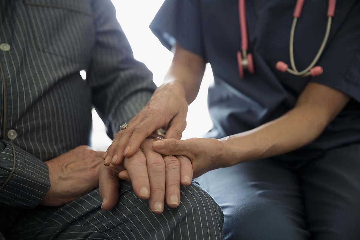 doctor comforting a patient