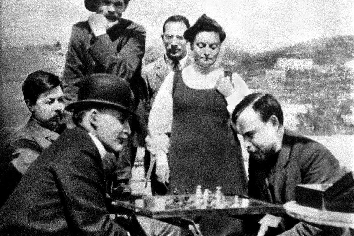 A bowler-hatted Lenin plays chess with Alexander Bogdanov