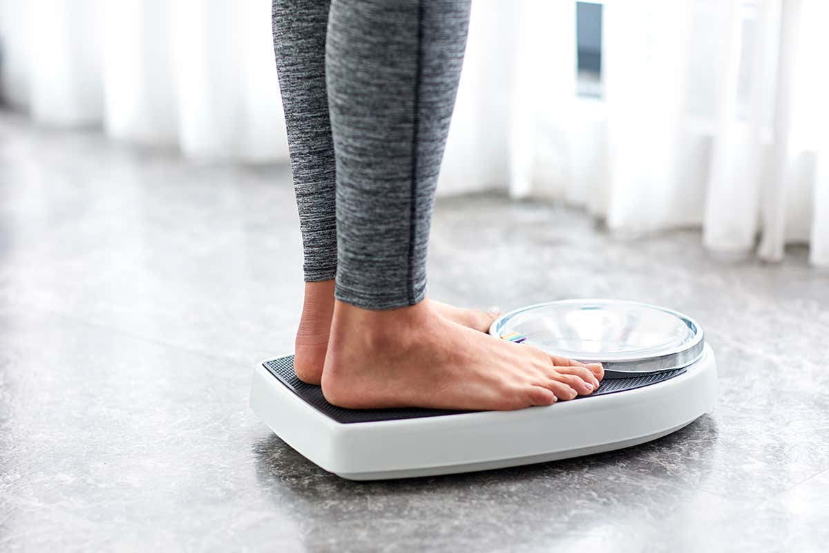 A woman on weighing scales