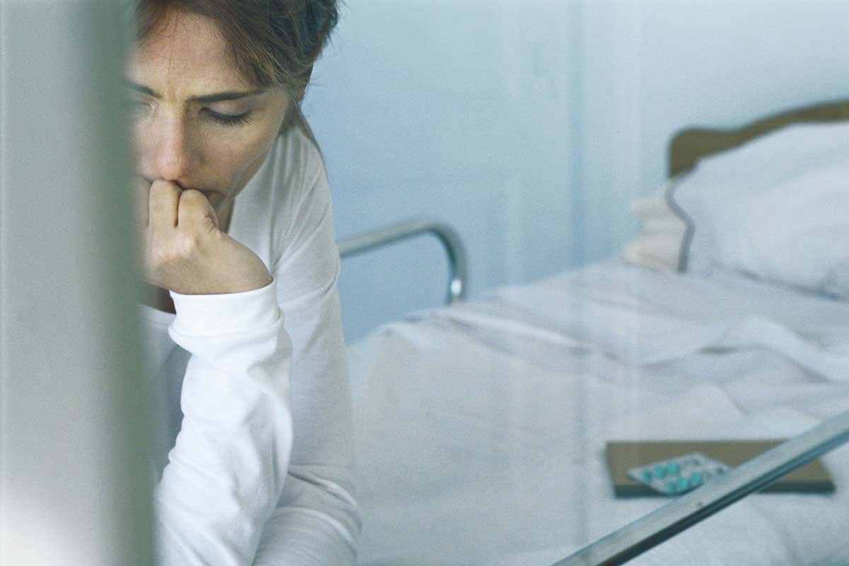 A woman on a hospital bed