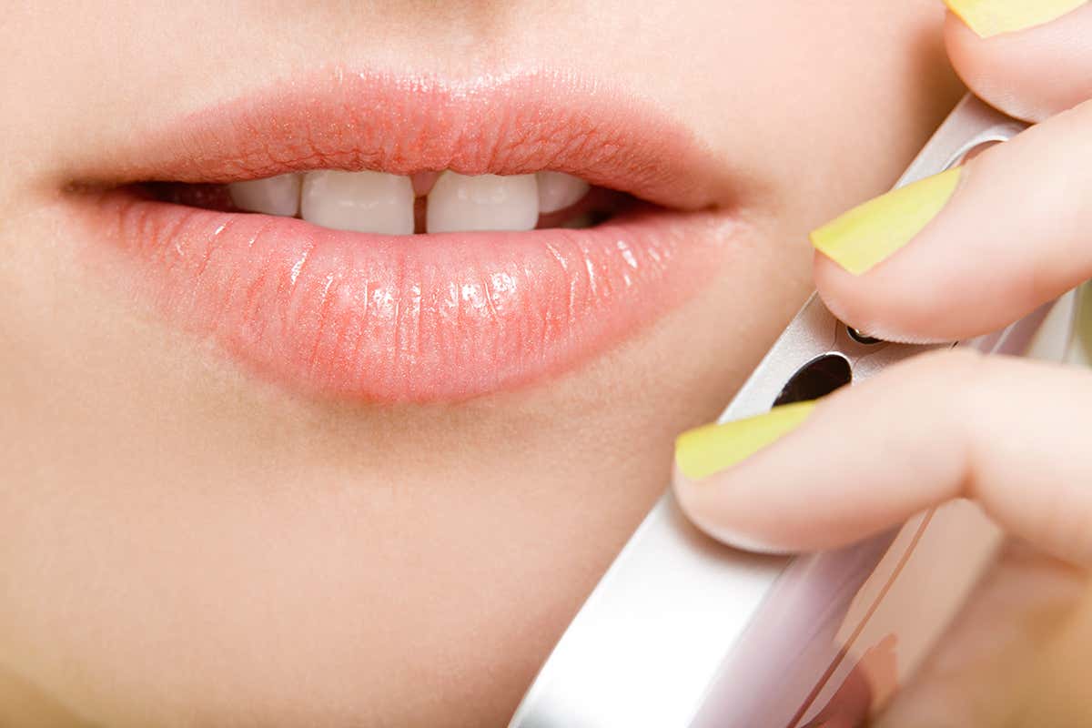 woman speaking to her phone